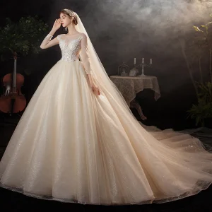 Charmant Champagne La Mariée Robe De Mariée 2020 Robe Boule Transparentes Encolure Dégagée Manches Longues Appliques En Dentelle Paillettes Perlage Glitter Tulle Cathedral Train Volants