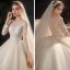 Charming Champagne Bridal Wedding Dresses 2020 Ball Gown See-through Scoop Neck Long Sleeve Appliques Lace Sequins Beading Glitter Tulle Cathedral Train Ruffle