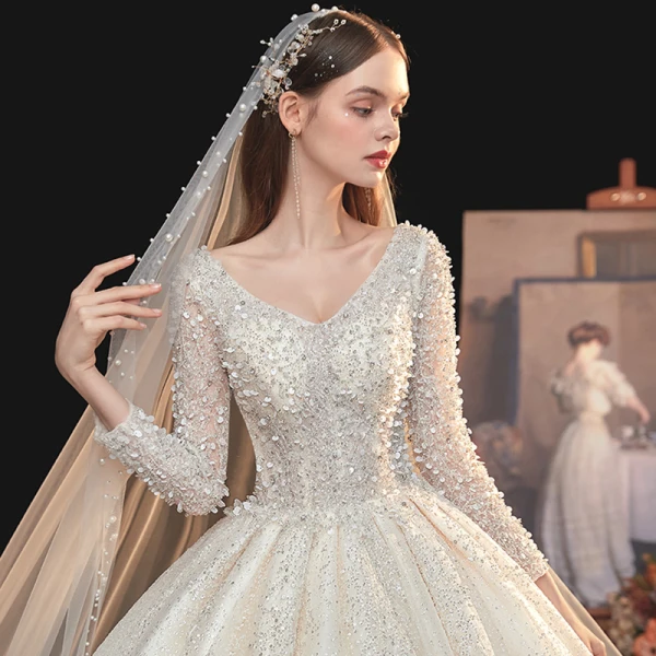 Meilleur Ivoire La Mariée Robe De Mariée 2020 Robe Boule V-Cou Manches Longues Dos Nu Paillettes Perlage Cathedral Train Volants