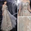 Illusion Gris Robe De Soirée 2020 Princesse Transparentes Encolure Dégagée Manches Courtes Perlage Paillettes Longue Volants Dos Nu Robe De Ceremonie