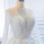 Luxe Blanche Transparentes La Mariée Robe De Mariée 2020 Robe Boule Encolure Dégagée Manches Longues Dos Nu Appliques Fleur Fait main Perlage Train De Balayage Volants