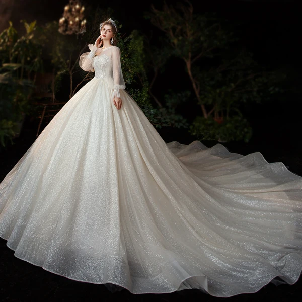 Victorian Style Champagne See-through Bridal Wedding Dresses 2020 Ball Gown Scoop Neck Puffy Long Sleeve Backless Appliques Lace Sequins Beading Glitter Tulle Cathedral Train Ruffle