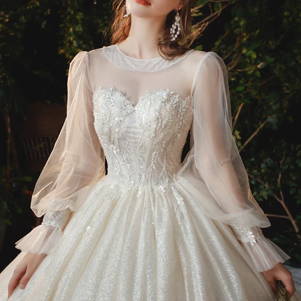 Victorian Style Champagne See-through Bridal Wedding Dresses 2020 Ball Gown Scoop Neck Puffy Long Sleeve Backless Appliques Lace Sequins Beading Glitter Tulle Cathedral Train Ruffle