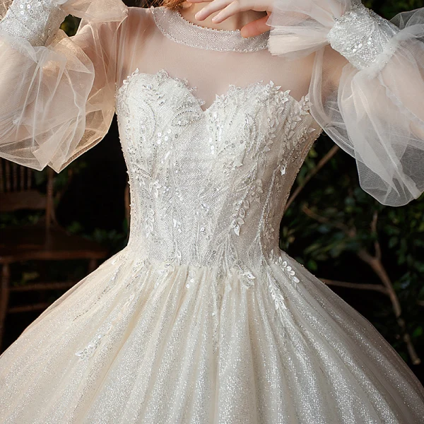 Victorian Style Champagne See-through Bridal Wedding Dresses 2020 Ball Gown Scoop Neck Puffy Long Sleeve Backless Appliques Lace Sequins Beading Glitter Tulle Cathedral Train Ruffle