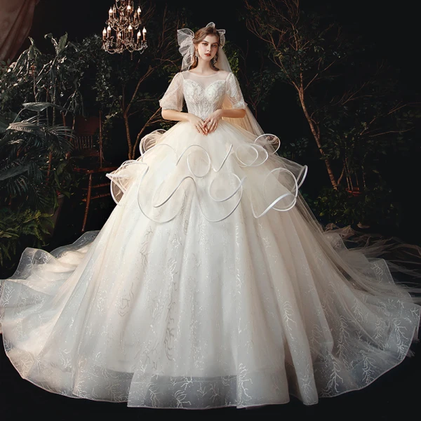 Style Victorien Champagne La Mariée Robe De Mariée 2020 Robe Boule Transparentes Encolure Dégagée Gonflée 1/2 Manches Dos Nu Perlage Glitter Tulle Cathedral Train Volants