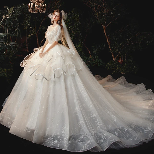 Style Victorien Champagne La Mariée Robe De Mariée 2020 Robe Boule Transparentes Encolure Dégagée Gonflée 1/2 Manches Dos Nu Perlage Glitter Tulle Cathedral Train Volants
