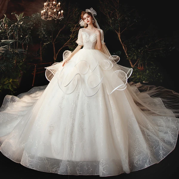 Style Victorien Champagne La Mariée Robe De Mariée 2020 Robe Boule Transparentes Encolure Dégagée Gonflée 1/2 Manches Dos Nu Perlage Glitter Tulle Cathedral Train Volants