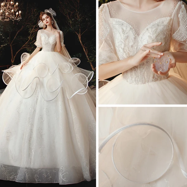 Style Victorien Champagne La Mariée Robe De Mariée 2020 Robe Boule Transparentes Encolure Dégagée Gonflée 1/2 Manches Dos Nu Perlage Glitter Tulle Cathedral Train Volants