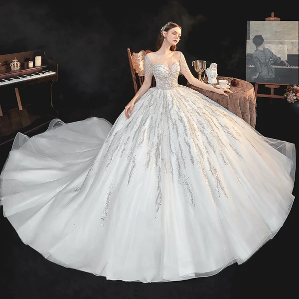 Meilleur Ivoire La Mariée Robe De Mariée 2020 Robe Boule Transparentes Encolure Carrée Manches Courtes Dos Nu Perlage Paillettes Cathedral Train Volants