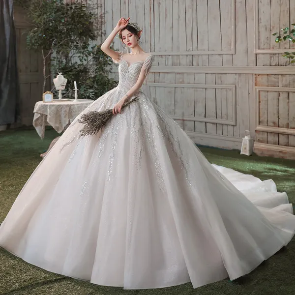Romantic Champagne See-through Bridal Wedding Dresses 2020 Ball Gown Scoop Neck Short Sleeve Backless Sequins Beading Glitter Tulle Cathedral Train Ruffle