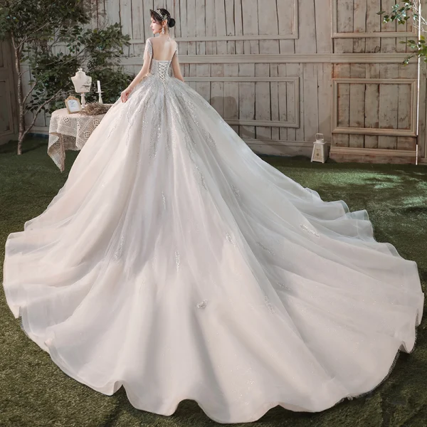 Romantique Champagne Transparentes La Mariée Robe De Mariée 2020 Robe Boule Encolure Dégagée Manches Courtes Dos Nu Paillettes Perlage Glitter Tulle Cathedral Train Volants