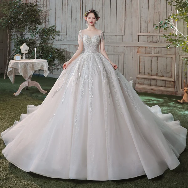 Romantique Champagne Transparentes La Mariée Robe De Mariée 2020 Robe Boule Encolure Dégagée Manches Courtes Dos Nu Paillettes Perlage Glitter Tulle Cathedral Train Volants