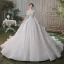 Romantique Champagne Transparentes La Mariée Robe De Mariée 2020 Robe Boule Encolure Dégagée Manches Courtes Dos Nu Paillettes Perlage Glitter Tulle Cathedral Train Volants