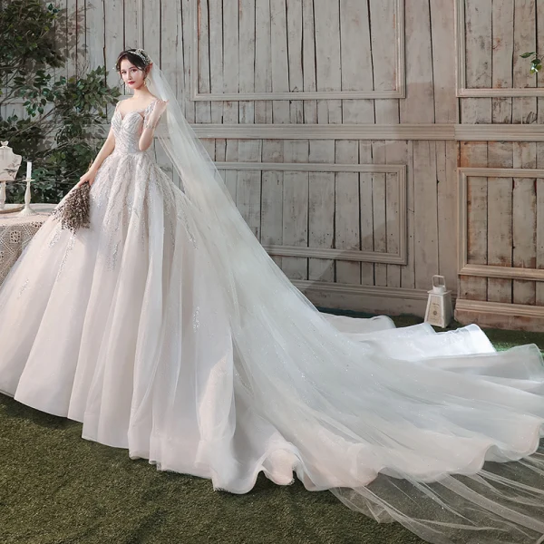 Romantique Champagne Transparentes La Mariée Robe De Mariée 2020 Robe Boule Encolure Dégagée Manches Courtes Dos Nu Paillettes Perlage Glitter Tulle Cathedral Train Volants