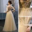 Sexy Champagner Ballkleider 2020 A Linie Spaghettiträger Tiefer V-Ausschnitt Ärmellos Perlenstickerei Strass Glanz Tülle Lange Rüschen Rückenfreies Festliche Kleider
