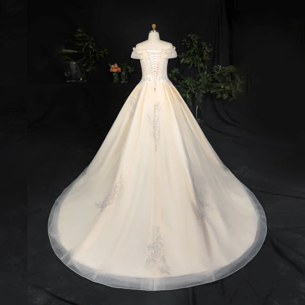 Sexy Atemberaubend Champagner Plus Größe Ballkleid Brautkleider / Hochzeitskleider 2020 Spitze Tülle Gekreuzte Träger Handgefertigt Perlenstickerei Pailletten Applikationen Rückenfreies Kapelle-Schleppe Hochzeit