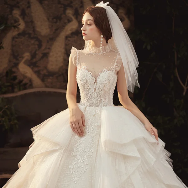 Luxury / Gorgeous Champagne See-through Wedding Dresses 2020 Ball Gown High Neck Sleeveless Backless Appliques Lace Beading Royal Train Ruffle