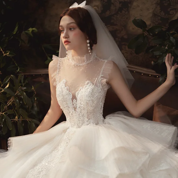 Luxury / Gorgeous Champagne See-through Wedding Dresses 2020 Ball Gown High Neck Sleeveless Backless Appliques Lace Beading Royal Train Ruffle