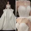 Vintage / Originale Transparentes Ivoire Satin Robe De Mariée 2020 Robe Boule Col Haut Manches Longues Dos Nu Appliques En Dentelle Fait main Perlage Royal Train Volants