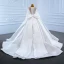 Luxe Blanche Satin La Mariée Robe De Mariée 2021 Robe Boule Transparentes Encolure Dégagée Manches Longues Dos Nu Perlage Paillettes Noeud Ceinture Tribunal Train