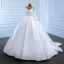 Luxe Blanche Satin La Mariée Robe De Mariée 2021 Robe Boule Transparentes Encolure Dégagée Manches Longues Dos Nu Perlage Paillettes Noeud Ceinture Tribunal Train