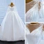 Luxe Blanche Satin La Mariée Robe De Mariée 2021 Robe Boule Transparentes Encolure Dégagée Manches Longues Dos Nu Perlage Paillettes Noeud Ceinture Tribunal Train