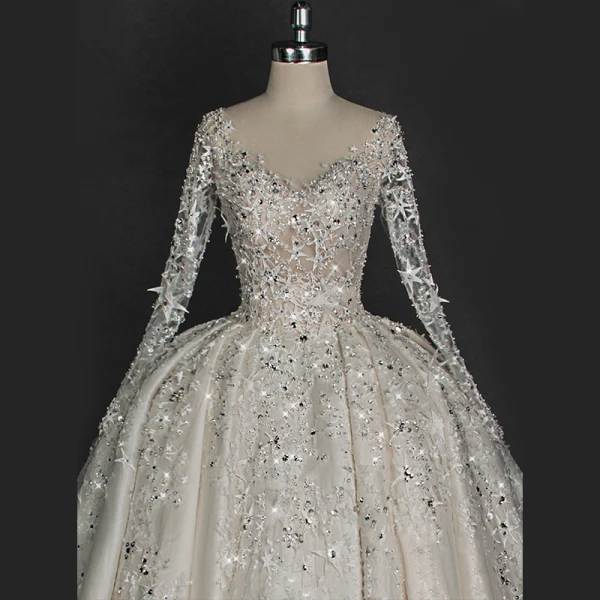 Illusion Ivory Wedding Dresses 2018 Ball Gown V-Neck Long Sleeve Backless Star Appliques Pierced Lace Glitter Rhinestone Cathedral Train Ruffle
