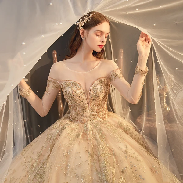 High-end Champagne Bridal Wedding Dresses 2021 Ball Gown See-through Scoop Neck Long Sleeve Backless Appliques Lace Beading Glitter Tulle Cathedral Train Ruffle