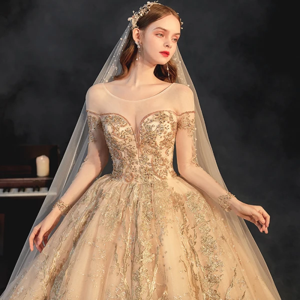 High-end Champagne Bridal Wedding Dresses 2021 Ball Gown See-through Scoop Neck Long Sleeve Backless Appliques Lace Beading Glitter Tulle Cathedral Train Ruffle