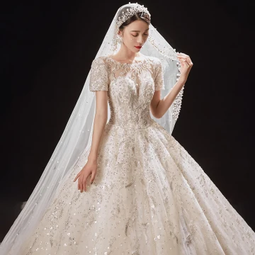 Luxe Champagne La Mariée Robe De Mariée 2021 Robe Boule Transparentes Encolure Dégagée Manches Courtes Dos Nu Appliques Fleur Perlage Glitter Tulle Cathedral Train Volants