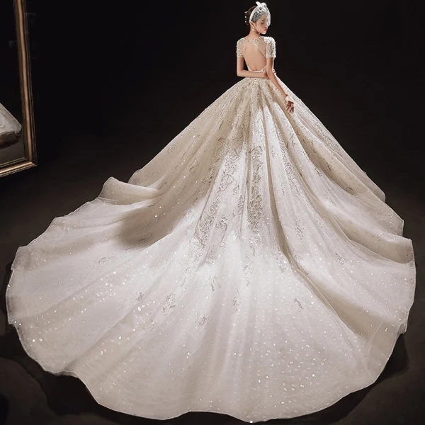 Luxury / Gorgeous Champagne Bridal Wedding Dresses 2021 Ball Gown See-through Scoop Neck Short Sleeve Backless Appliques Flower Beading Glitter Tulle Cathedral Train Ruffle