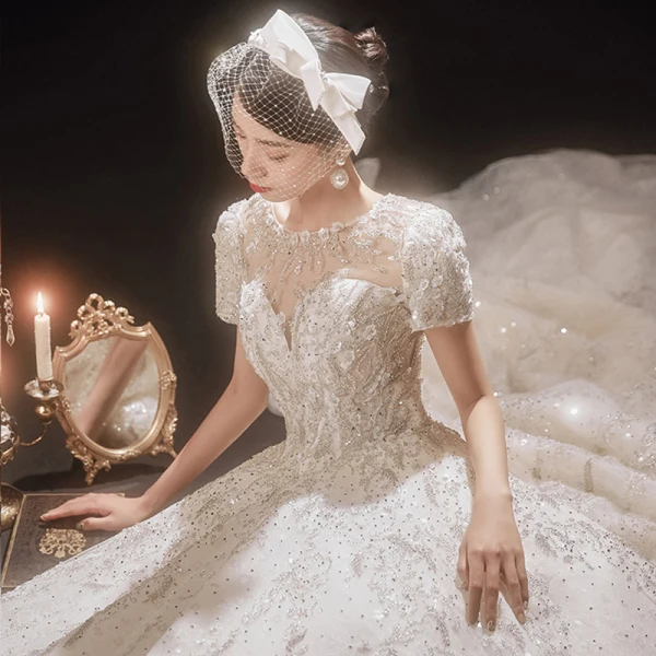 Luxury / Gorgeous Champagne Bridal Wedding Dresses 2021 Ball Gown See-through Scoop Neck Short Sleeve Backless Appliques Flower Beading Glitter Tulle Cathedral Train Ruffle