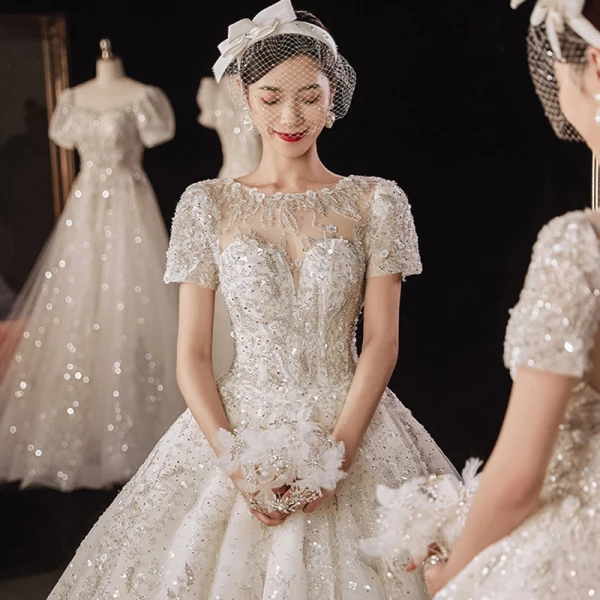 Luxury / Gorgeous Champagne Bridal Wedding Dresses 2021 Ball Gown See-through Scoop Neck Short Sleeve Backless Appliques Flower Beading Glitter Tulle Cathedral Train Ruffle