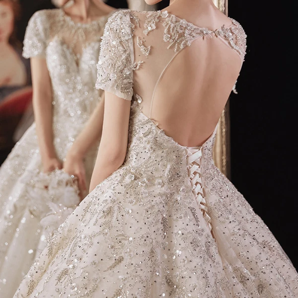 Luxury / Gorgeous Champagne Bridal Wedding Dresses 2021 Ball Gown See-through Scoop Neck Short Sleeve Backless Appliques Flower Beading Glitter Tulle Cathedral Train Ruffle