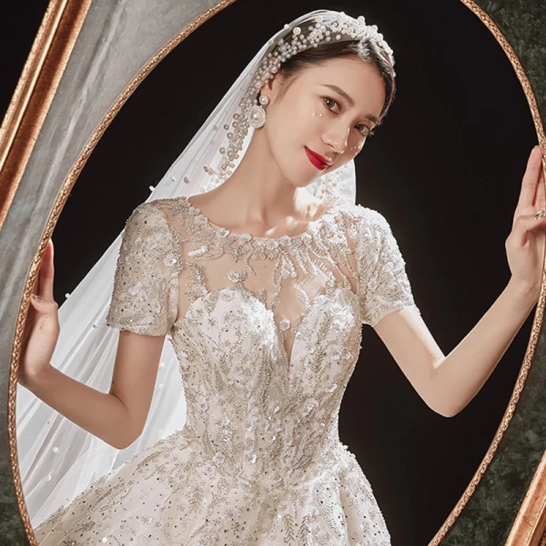 Luxury / Gorgeous Champagne Bridal Wedding Dresses 2021 Ball Gown See-through Scoop Neck Short Sleeve Backless Appliques Flower Beading Glitter Tulle Cathedral Train Ruffle