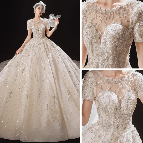 Luxury / Gorgeous Champagne Bridal Wedding Dresses 2021 Ball Gown See-through Scoop Neck Short Sleeve Backless Appliques Flower Beading Glitter Tulle Cathedral Train Ruffle