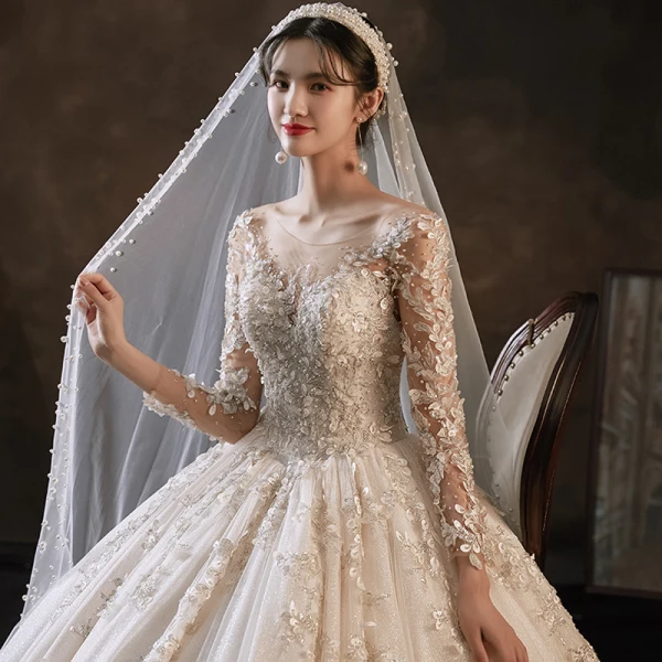 Charming Champagne Handmade  Bridal Wedding Dresses 2021 Ball Gown See-through Scoop Neck Long Sleeve Backless Appliques Lace Beading Glitter Tulle Cathedral Train Ruffle