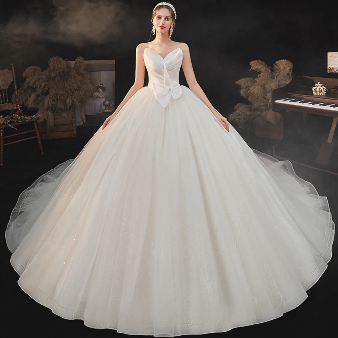 Enkel Champagne Bryllups Brudekjoler 2021 Ballkjole Kjæreste Uten Ermer Ryggløse Sløyfe Glitter Tyll Cathedral Train Buste