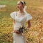 High End Garten / Im Freien Ivory / Creme Spitze Brautkleider / Hochzeitskleider 2021 Meerjungfrau Eckiger Ausschnitt Geschwollenes Kurze Ärmel Rückenfreies Perlenstickerei Perle Stoffgürtel Sweep / Pinsel Zug Rüschen