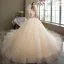 Romantique Champagne La Mariée Robe De Mariée 2021 Robe Boule Transparentes Encolure Dégagée Gonflée Manches Courtes Dos Nu Appliques En Dentelle Perlage Paillettes Glitter Tulle Cathedral Train Volants