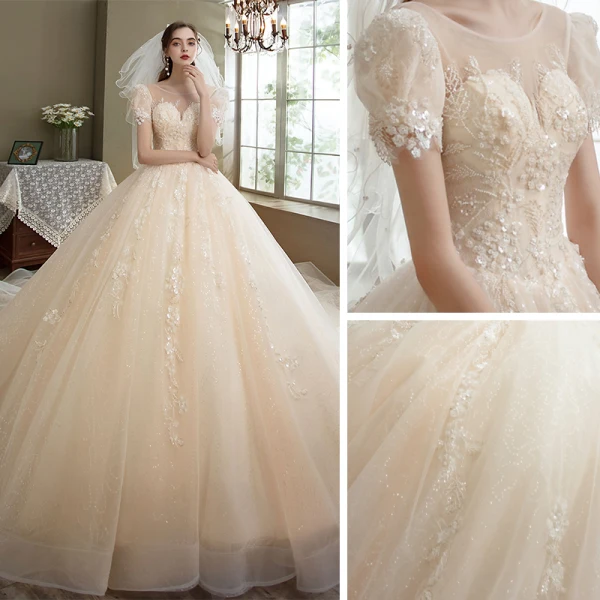 Romantique Champagne La Mariée Robe De Mariée 2021 Robe Boule Transparentes Encolure Dégagée Gonflée Manches Courtes Dos Nu Appliques En Dentelle Perlage Paillettes Glitter Tulle Cathedral Train Volants
