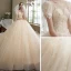 Romantique Champagne La Mariée Robe De Mariée 2021 Robe Boule Transparentes Encolure Dégagée Gonflée Manches Courtes Dos Nu Appliques En Dentelle Perlage Paillettes Glitter Tulle Cathedral Train Volants