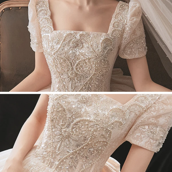 Classique Champagne La Mariée Robe De Mariée 2021 Robe Boule Encolure Carrée Gonflée Manches Courtes Dos Nu Noeud Perlage Paillettes Glitter Tulle Cathedral Train Volants