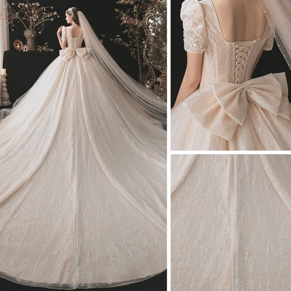 Classique Champagne La Mariée Robe De Mariée 2021 Robe Boule Encolure Carrée Gonflée Manches Courtes Dos Nu Noeud Perlage Paillettes Glitter Tulle Cathedral Train Volants
