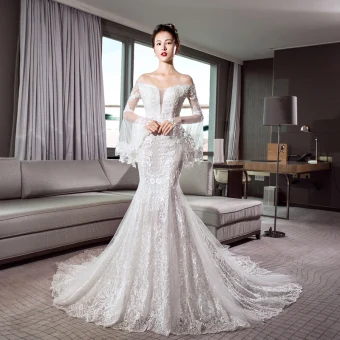 Luxe Ivoire Transparentes Robe De Mariée 2018 Trompette Sirène De L Épaule Manches De Cloche Dos Nu Appliques En Dentelle Glitter Tulle Chapel Train Volants