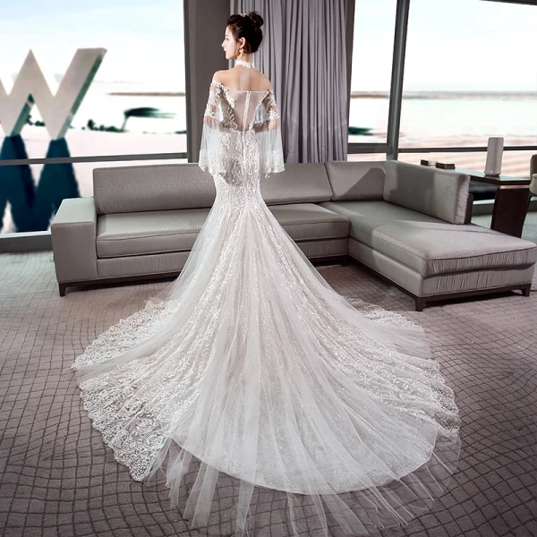 Luxe Ivoire Transparentes Robe De Mariée 2018 Trompette / Sirène De l'épaule Manches de cloche Dos Nu Appliques En Dentelle Glitter Tulle Chapel Train Volants