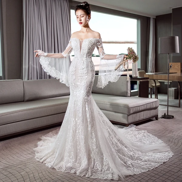 Luxe Ivoire Transparentes Robe De Mariée 2018 Trompette / Sirène De l'épaule Manches de cloche Dos Nu Appliques En Dentelle Glitter Tulle Chapel Train Volants