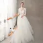 Illusion Ivory / Creme Durchsichtige Brautkleider / Hochzeitskleider 2018 A Linie Rundhalsausschnitt Lange Ärmel Rückenfreies Applikationen Spitze Sweep / Pinsel Zug Rüschen