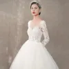 Illusion Ivory See-through Wedding Dresses 2018 A-Line / Princess Scoop Neck Long Sleeve Backless Appliques Lace Sweep Train Ruffle
