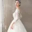 Illusion Ivory / Creme Durchsichtige Brautkleider / Hochzeitskleider 2018 A Linie Rundhalsausschnitt Lange Ärmel Rückenfreies Applikationen Spitze Sweep / Pinsel Zug Rüschen